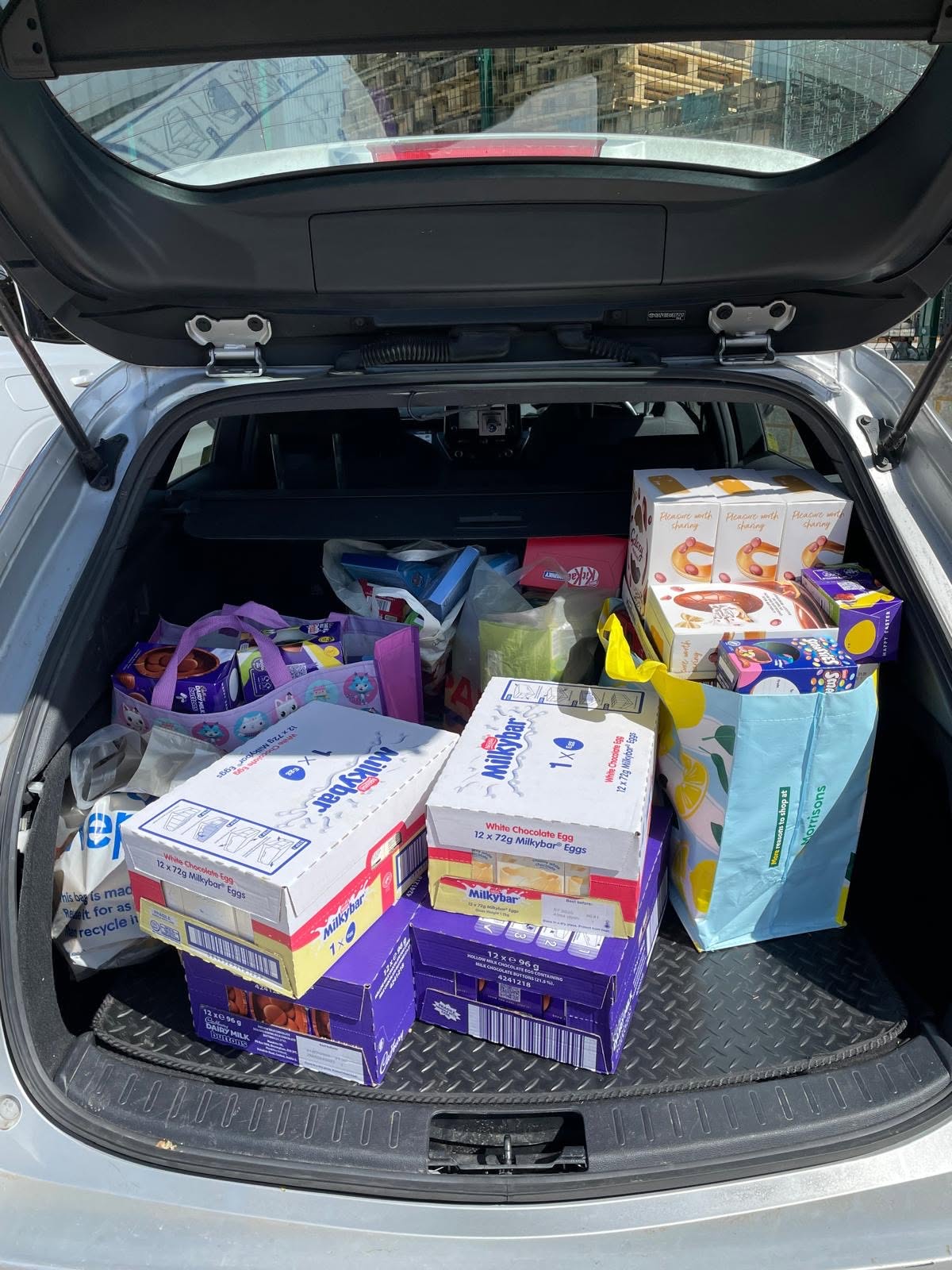 247 Taxis car loaded with Easter eggs for the community