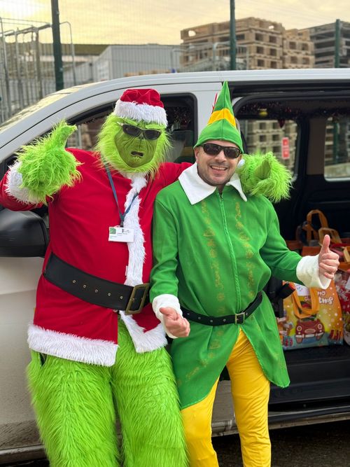 247 Taxis drivers dressed as the Grinch and an elf for charity